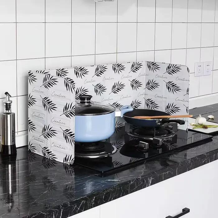 Plaque de protection pliable en aluminium pour cuisinière à gaz
